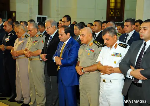 A handout picture released by the Egyptian Presidency on July 4, 2016, shows Egyptian President Abdel Fattah al-Sisi attends the morning prayers for Eid al-Fitr celebrations, which marks the end of the holy fasting month...