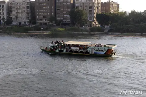 A boat cruises along the Nile River on the third day of Eid al-Fitr holiday which marks the end of the Muslim holy month of Ramadan, in Cairo, Egypt, on July 08, 2016. Photo by Amr Sayed