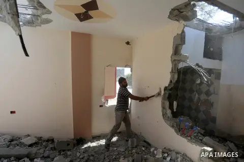Palestinian construction workers work at the house, to marking the second anniversary of the 50-day Israeli war on Gaza Strip last summer, in Shejaiya neighborhood in Gaza city July 9, 2016. July 8th marks the two-year a...