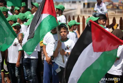 Palestinian children take part in a summer camp organized by Hamas movement in Gaza city on July 10, 2016. Hamas movement organized dozens of summer camps for Palestinian children during the period of school holidays. Ph...