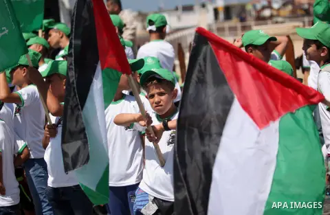 Palestinian children take part in a summer camp organized by Hamas movement in Gaza city on July 10, 2016. Hamas movement organized dozens of summer camps for Palestinian children during the period of school holidays. Ph...