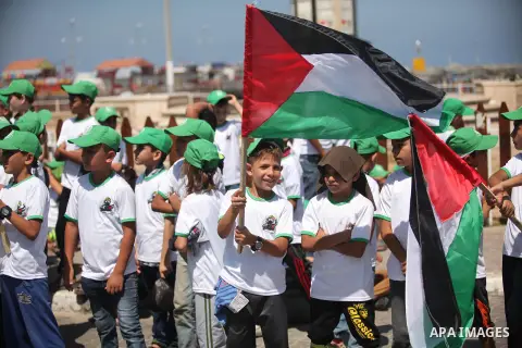 Palestinian children take part in a summer camp organized by Hamas movement in Gaza city on July 10, 2016. Hamas movement organized dozens of summer camps for Palestinian children during the period of school holidays. Ph...