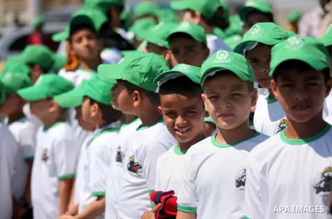 Palestinian children take part in a summer camp organized by Hamas movement in Gaza city on July 10, 2016. Hamas movement organized dozens of summer camps for Palestinian children during the period of school holidays. Ph...