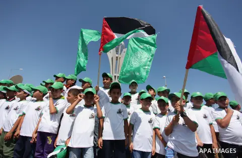 Palestinian children take part in a summer camp organized by Hamas movement in Gaza city on July 10, 2016. Hamas movement organized dozens of summer camps for Palestinian children during the period of school holidays. Ph...