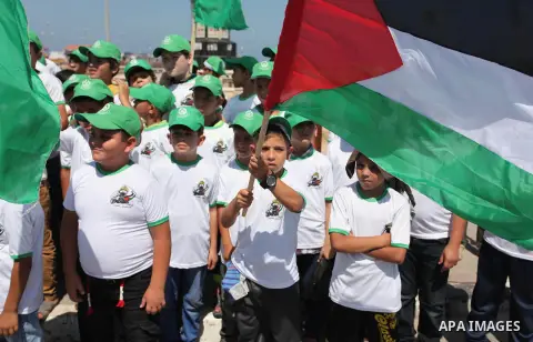 Palestinian children take part in a summer camp organized by Hamas movement in Gaza city on July 10, 2016. Hamas movement organized dozens of summer camps for Palestinian children during the period of school holidays. Ph...