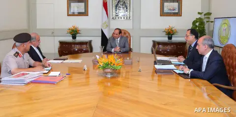 Egyptian President Abdel Fattah al-Sisi meets with Egyptian Prime Minister Sharif Ismail and Mustafa Madbouli, Housing Minister, in Cairo, Egypt, on July 10, 2016. Photo by Egyptian President Office