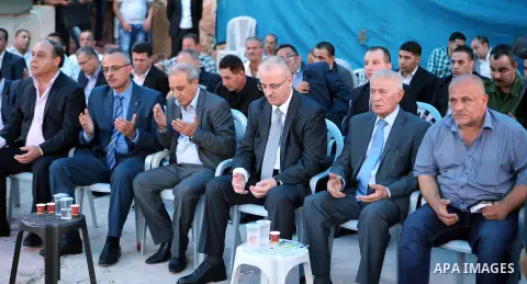 Palestinian Prime Minister Rami Hamdallah offers condolences to the Family of Palestinian Yasser Nazzal, in the West Bank, City of Jenin, on July 10, 2016. Photo by Prime Minister Office