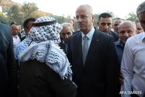 Palestinian Prime Minister Rami Hamdallah offers condolences to the Family of Palestinian Yasser Nazzal, in the West Bank, City of Jenin, on July 10, 2016. Photo by Prime Minister Office