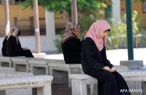 Palestinian high school students look for their results of final high school exams, known as "Tawjihi" in Gaza city on July 11, 2016. Photo by Mohammed Asad