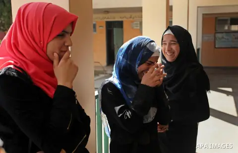 Palestinian high school students celebrate after heard their results of final exams known as "Tawjihi" in Gaza city on July 11, 2016. Photo by Ashraf Amra