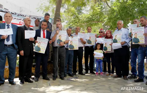 Palestinians take part in a demonstration calling for the release of Bilal Kayed a Palestinian prisoner on hunger strike, in the West bank city of Hebron on July 12, 2016. Photo by Wisam Hashlamoun