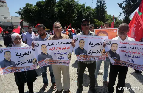 Supporters of the Popular Front for the Liberation of Palestine (PFLP) take part in a demonstration calling for the release of Bilal Kayed a Palestinian prisoner on hunger strike, in Gaza city on July 13, 2016. Photo by...