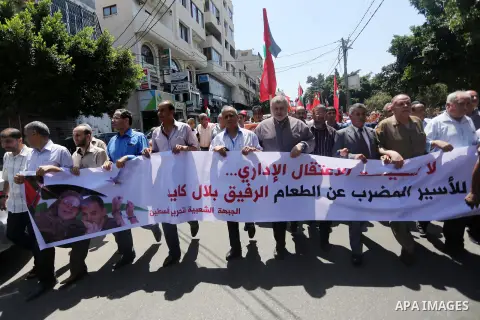 Supporters of the Popular Front for the Liberation of Palestine (PFLP) take part in a demonstration calling for the release of Bilal Kayed a Palestinian prisoner on hunger strike, in Gaza city on July 13, 2016. Photo by...