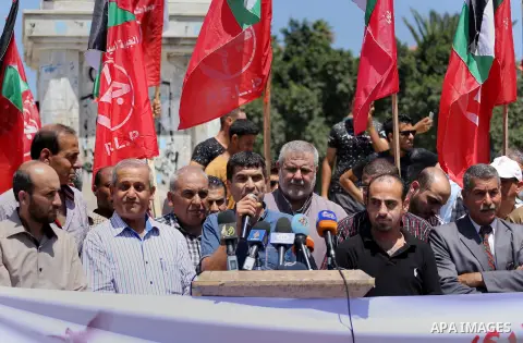 Supporters of the Popular Front for the Liberation of Palestine (PFLP) take part in a demonstration calling for the release of Bilal Kayed a Palestinian prisoner on hunger strike, in Gaza city on July 13, 2016. Photo by...