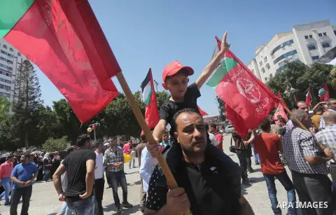 Supporters of the Popular Front for the Liberation of Palestine (PFLP) take part in a demonstration calling for the release of Bilal Kayed a Palestinian prisoner on hunger strike, in Gaza city on July 13, 2016. Photo by...