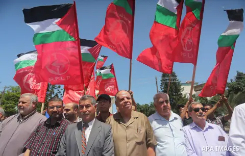 Supporters of the Popular Front for the Liberation of Palestine (PFLP) take part in a demonstration calling for the release of Bilal Kayed a Palestinian prisoner on hunger strike, in Gaza city on July 13, 2016. Photo by...