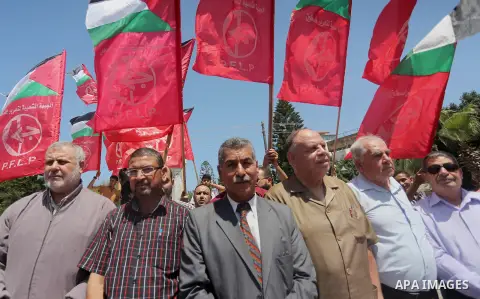 Supporters of the Popular Front for the Liberation of Palestine (PFLP) take part in a demonstration calling for the release of Bilal Kayed a Palestinian prisoner on hunger strike, in Gaza city on July 13, 2016. Photo by...