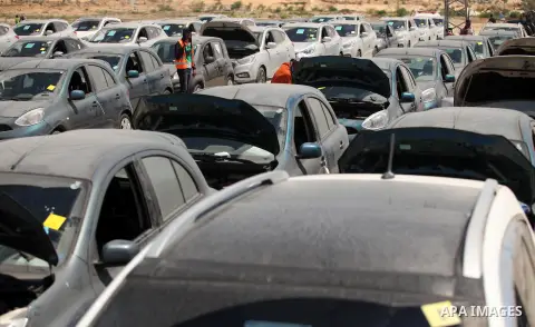 Palestinian men inspect vehicles that came from Israel to serve the Gaza Strip market on July 14, 2016 in the Palestinian side of the Erez crossing with Israel. Israel opened the major Erez crossing point between Israel...