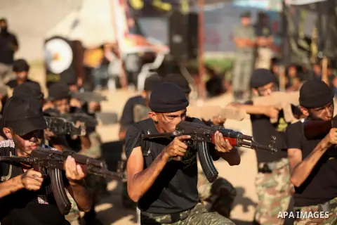 Palestinian youths take part in a military-style graduation ceremony at a summer camp organized by the Islamic Jihad Movement in Khan Younis in the southern Gaza Strip July 15, 2016. Photo by Ashraf Amra