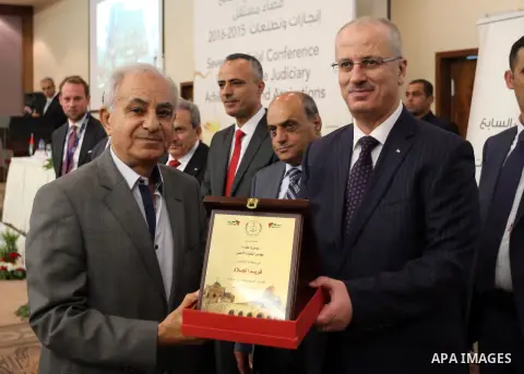Palestinian Prime Minister Rami Hamdallah delivers a speech during the opening of the Seventh Judicial Conference, in the West Bank city of Ramallah july 17, 2016. Photo by Prime Minister Office