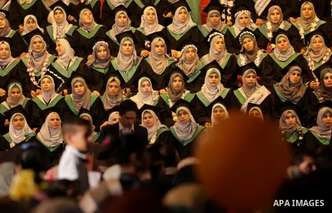 Palestinian students participate in their graduation ceremony at the University College of Applied Sciences in Gaza city on July 17, 2016. Photo by Mohammed Asad