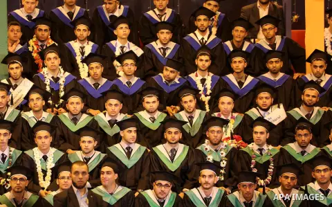 Palestinian students participate in their graduation ceremony at the University College of Applied Sciences in Gaza city on July 17, 2016. Photo by Mohammed Asad