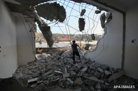 A Palestinian man checks on July 18, 2016 the rubble of a house belonging to a Palestinian man accused by Israeli authorities in taking part in an attack in Jerusalem in which an Israeli policewoman was killed, after it...