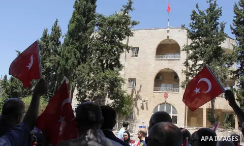 Palestinians wave Turkish flags during a protest against the military coup attempt in Turkey, in front of the Turkish consulate in east Jerusalem on July 18, 2016. Photo by Mahfouz Abu Turk