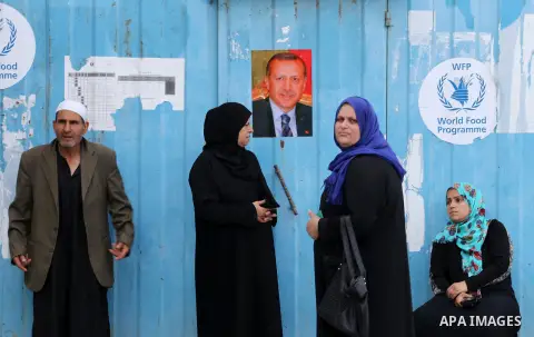 Palestinians receive Turkish aid at an aid distribution centre in Gaza city, on July 19, 2016. The aid, consisting of flour, sugar and rice, was allowed into the Palestinian territory via Israel’s Kerem Shalom crossing a...