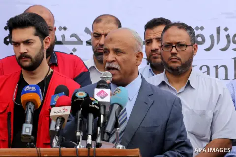 Palestinians receive Turkish aid at an aid distribution centre in Gaza city, on July 19, 2016. The aid, consisting of flour, sugar and rice, was allowed into the Palestinian territory via Israel’s Kerem Shalom crossing a...