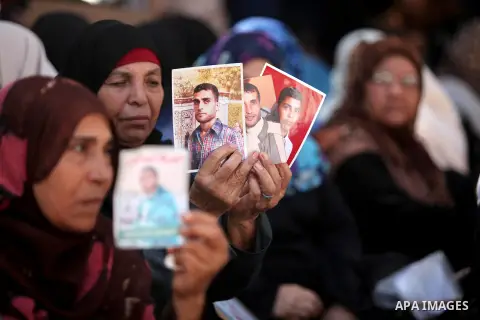 Palestinian families of martyrs take part a protest to demand their rights and salaries, in Gaza city, on July 19, 2016. Photo by Ashraf Amra