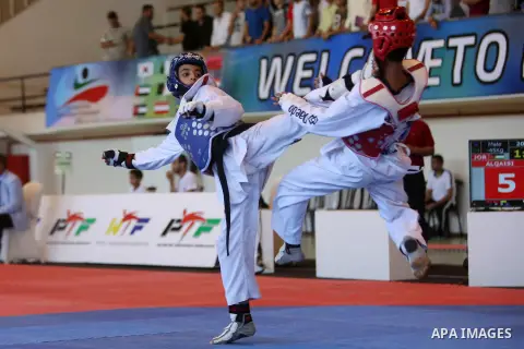 Taekwondo fighters spar during the International Taekwondo Championships at the Birzeit University in the West Bank city of Ramallah on July 19, 2016. Foreign football teams have already played matches in the Palestinian...