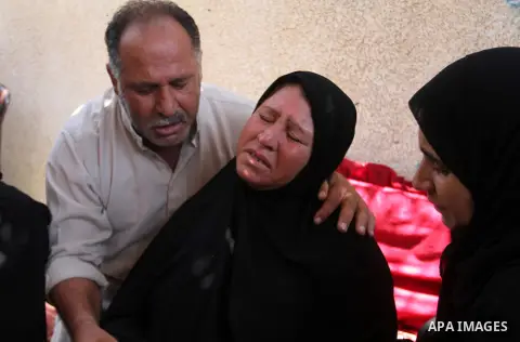 Palestinian relatives and friends mourn during the funeral of Salah al-Astal, a member of the Islamic Jihad's armed wing -the Al-Quds Brigades- who died after a tunnel collapse in the Gaza Strip, on July 19, 2016 in Khan...