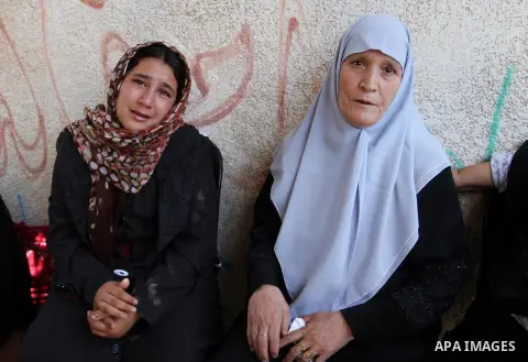 Palestinian relatives and friends mourn during the funeral of Salah al-Astal, a member of the Islamic Jihad's armed wing -the Al-Quds Brigades- who died after a tunnel collapse in the Gaza Strip, on July 19, 2016 in Khan...
