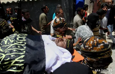 Palestinian members of the Islamic Jihad's armed wing, the Al-Quds Brigades, carry the body of a fellow militant, Salah al-Astal, who died after a tunnel collapse in the Gaza Strip, during his funeral in Khan Younis in t...