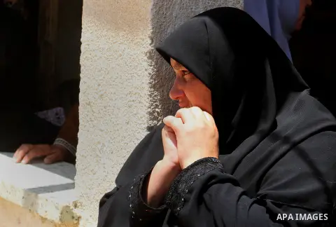 Palestinian relatives and friends mourn during the funeral of Salah al-Astal, a member of the Islamic Jihad's armed wing -the Al-Quds Brigades- who died after a tunnel collapse in the Gaza Strip, on July 19, 2016 in Khan...