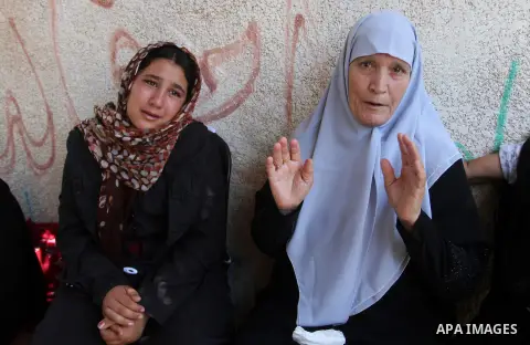Palestinian relatives and friends mourn during the funeral of Salah al-Astal, a member of the Islamic Jihad's armed wing -the Al-Quds Brigades- who died after a tunnel collapse in the Gaza Strip, on July 19, 2016 in Khan...