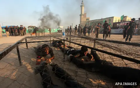 Palestinian youths demonstrate their skills during a military-style exercise at the Liberation Youths summer camp, organised by the Hamas movement, in Gaza city on July 20, 2016. Photo by Ashraf Amra