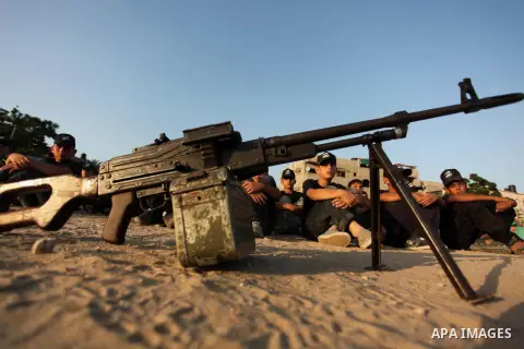 Palestinian youths take part in a military-style exercise at the Liberation Youths summer camp, organised by the Hamas movement, in Gaza city on July 20, 2016. Photo by Ashraf Amra