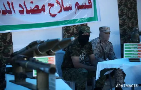 A picture taken on July 21, 2016 shows weapons during a weapon exhibition at a Hamas-run youth summer camp, in Gaza City. Photo by Ashraf Amra