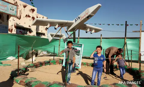 Palestinians watch the Hamas drone "Ababil" during a weapon exhibition at a Hamas-run youth summer camp, in Gaza City, on July 21, 2016. Photo by Ashraf Amra