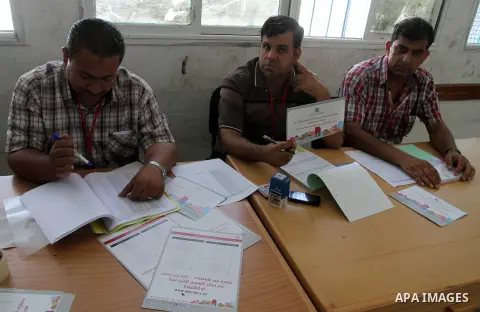 Palestinians from Central Elections Commission (CEO) work at Voter registration centers in Rafah in the southern Gaza strip on July 23, 2016. The Palestinian Central Elections Commission (CEO) announced Saturday that vot...