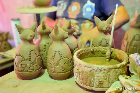 Pottery vessels are seen drying at a pottery workshop in Cairo, on July 24, 2016. Pottery is an ancient and traditional craft in Egypt. Local workshops usually produce products such as bowls, pitchers, flower pots, and v...