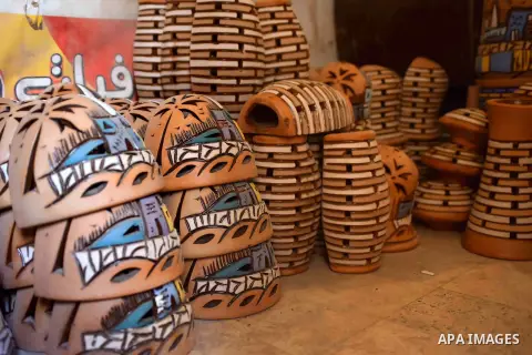 Pottery vessels are seen drying at a pottery workshop in Cairo, on July 24, 2016. Pottery is an ancient and traditional craft in Egypt. Local workshops usually produce products such as bowls, pitchers, flower pots, and v...