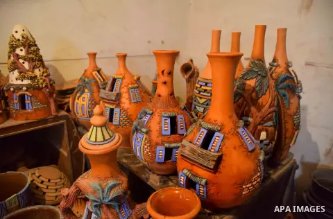 Pottery vessels are seen drying at a pottery workshop in Cairo, on July 24, 2016. Pottery is an ancient and traditional craft in Egypt. Local workshops usually produce products such as bowls, pitchers, flower pots, and v...