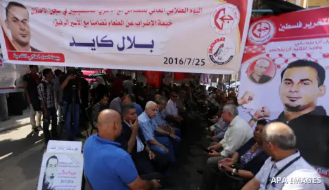 Supporters of the Popular Front for the Liberation of Palestine (PFLP) take part in a protest demanding for the release of Bilal Kayed a Palestinian prisoner on hunger strike,, in front of Red cross office, in Gaza city...