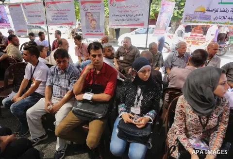 Supporters of the Popular Front for the Liberation of Palestine (PFLP) take part in a protest demanding for the release of Bilal Kayed a Palestinian prisoner on hunger strike,, in front of Red cross office, in Gaza city...