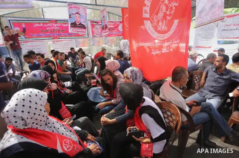 Supporters of the Popular Front for the Liberation of Palestine (PFLP) take part in a protest demanding for the release of Bilal Kayed a Palestinian prisoner on hunger strike,, in front of Red cross office, in Gaza city...