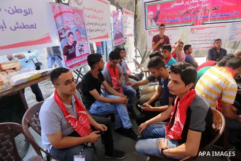 Supporters of the Popular Front for the Liberation of Palestine (PFLP) take part in a protest demanding for the release of Bilal Kayed a Palestinian prisoner on hunger strike,, in front of Red cross office, in Gaza city...