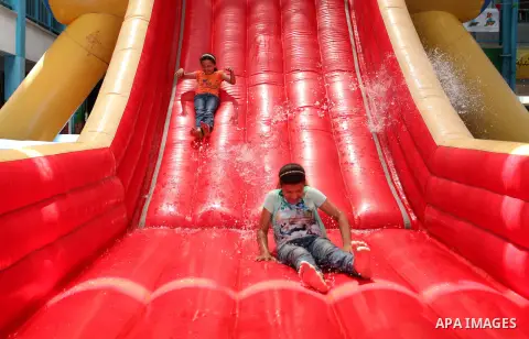 Palestinian schoolgirls enjoy as part of the activities proposed during a summer camp organised by the United Nations on July 25, 2016 in Gaza City. Photo by Ashraf Amra
